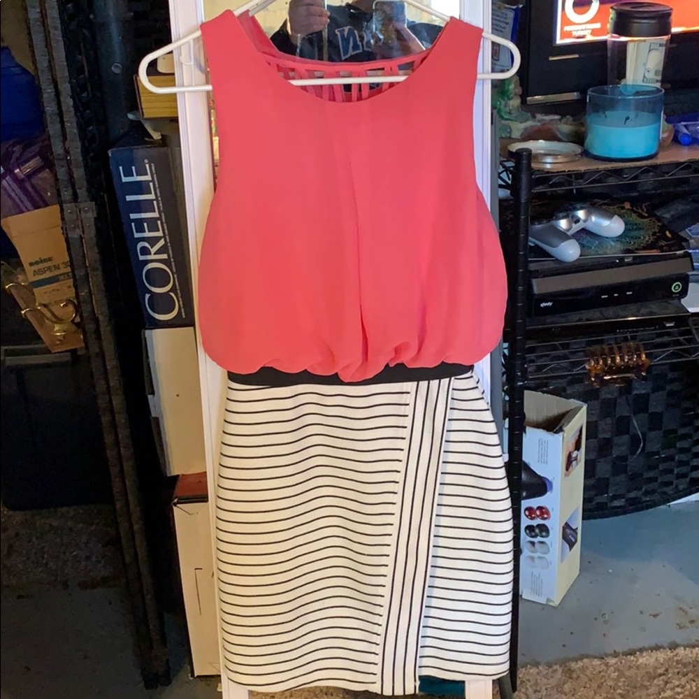 Coral dress, with striped pencil bottom.